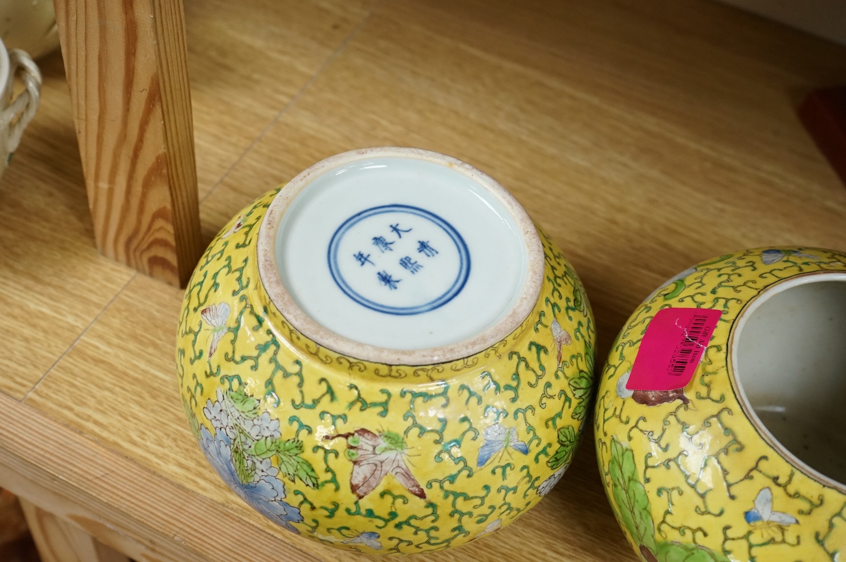 A Chairman Mao porcelain figure and a pair of Chinese yellow ground bowls decorated with flowers and insects, largest 30cm high